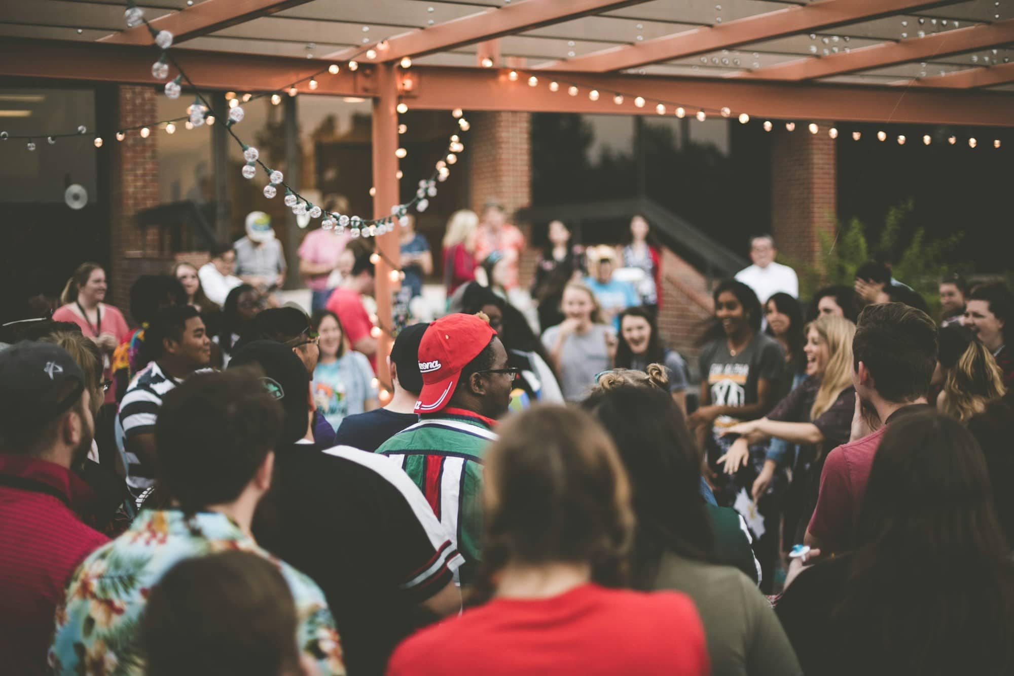 Bitcoiners gathered under string lights for the meetup